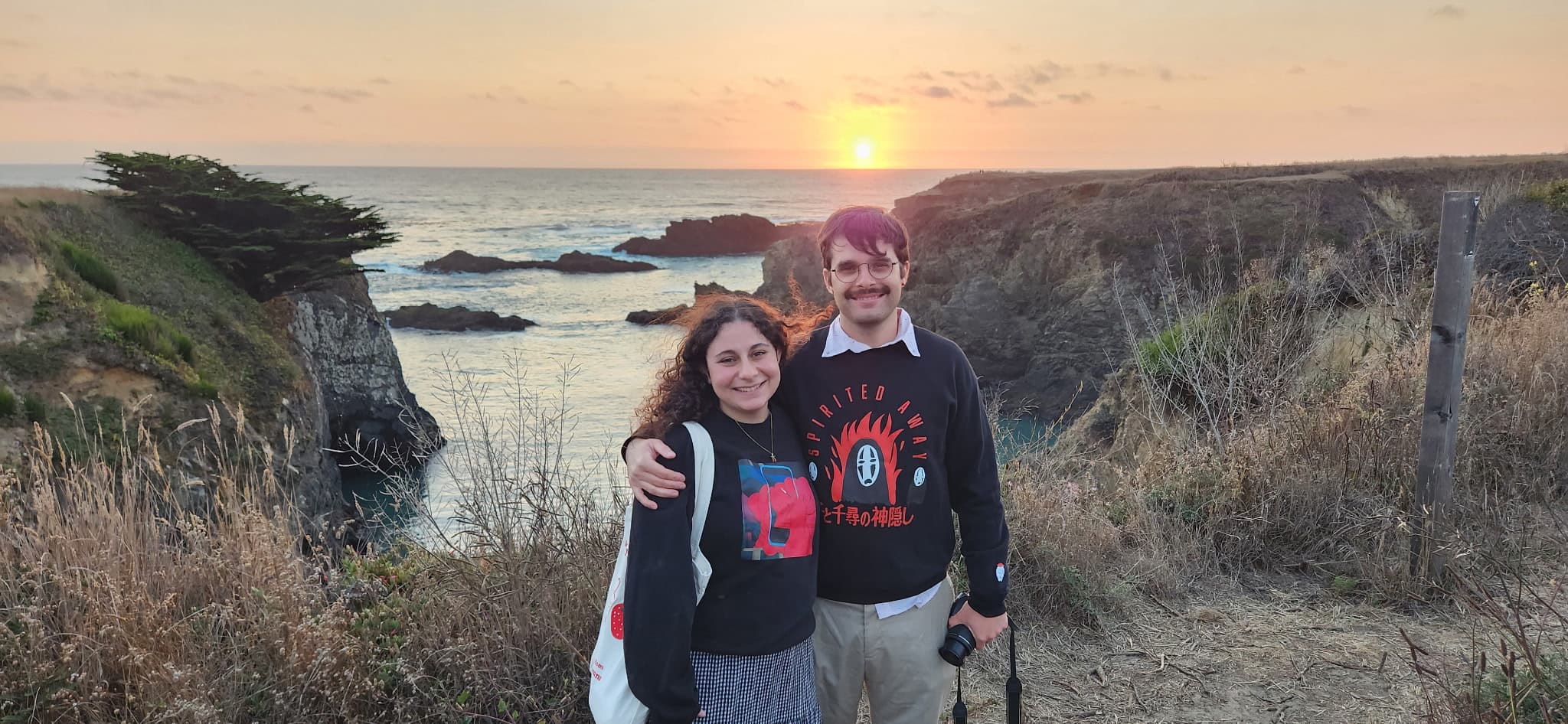 Andrew and his partner at sunset on the coast